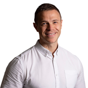 An image of Adam Woodward smiling at the camera.