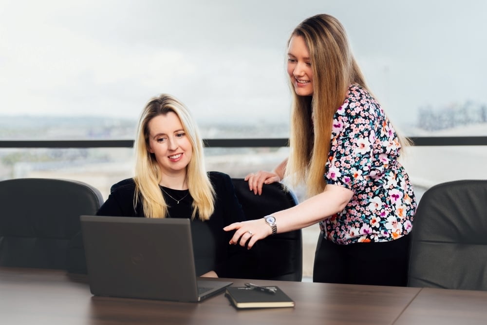 AAB team members sitting in a meeting room