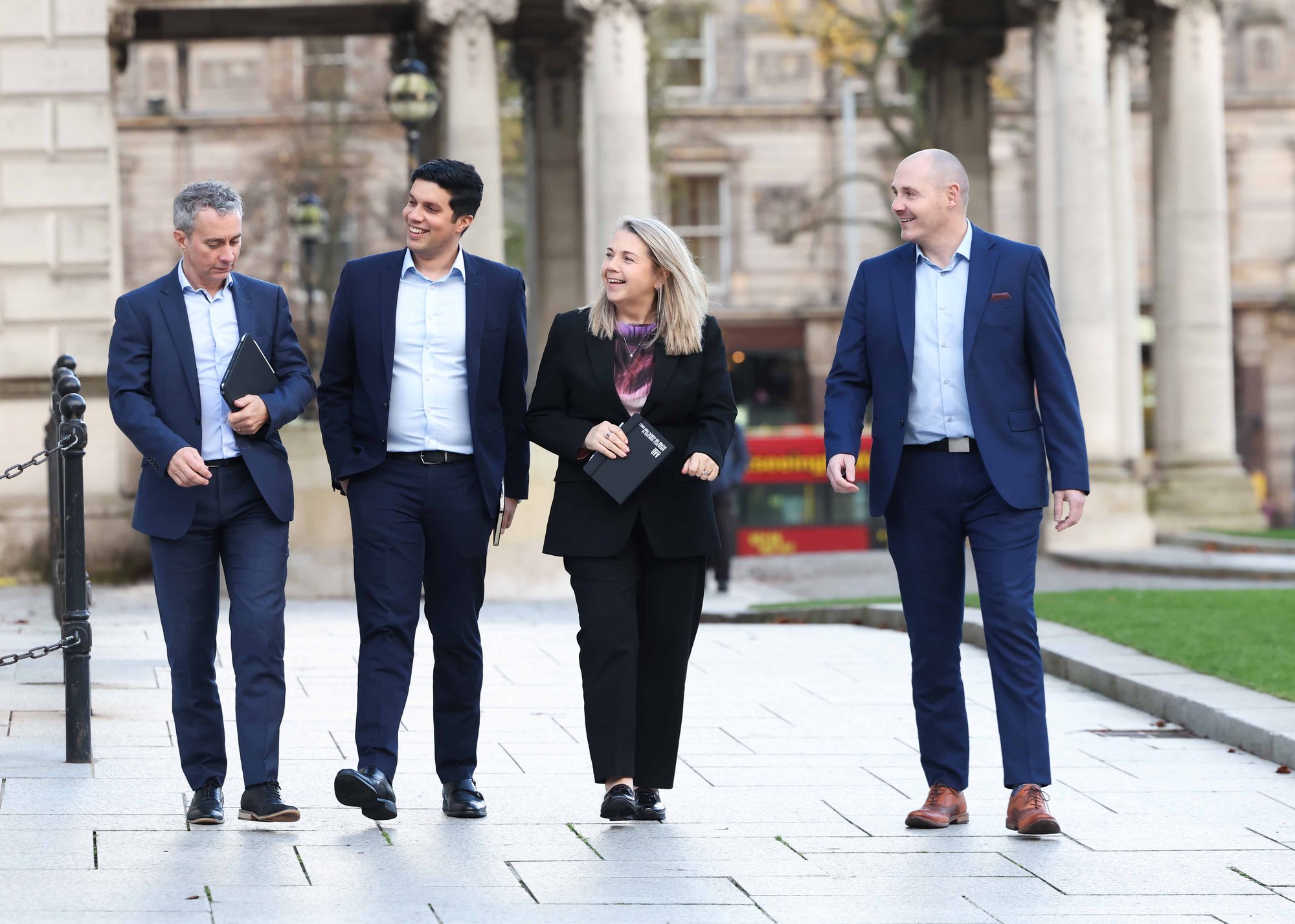 An image of Ashok Thomas, Michelle Hawkins, Malachy McLernon, Shane Martin walking outside and sharing conversation.