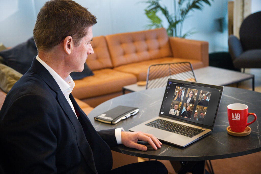 An image of an AAB team member on a video call on his laptop.